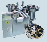 Automatic Double Head Filling,
Plugging & Capping Machine